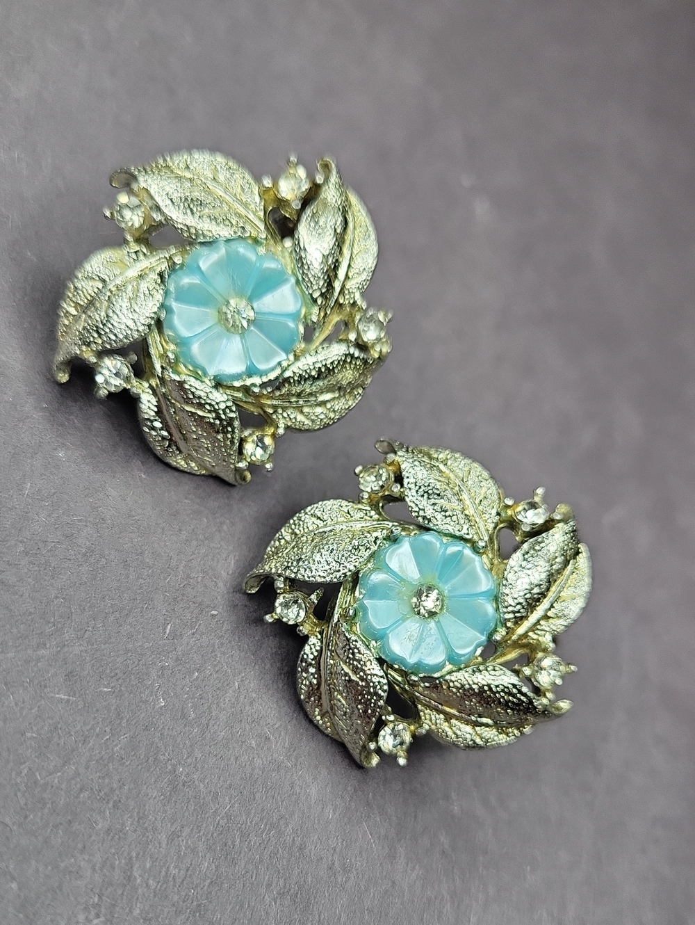 Silvor-Tone Floral Leaf Clip Earrings with Blue Flower Center